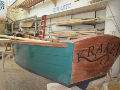 Photo of Kraken dinghy in the ship builder shop at The Independence Seaport Museum