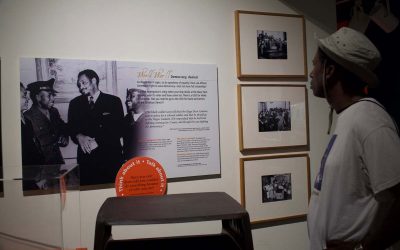 Museum guest reading information in the Tides of Freedom exhibit at The Independence Seaport Museum